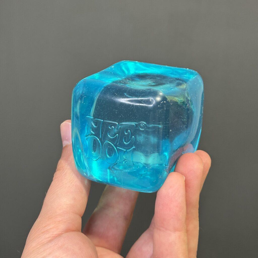 NeeDoh Nice Cube blue translucent squishy stress ball